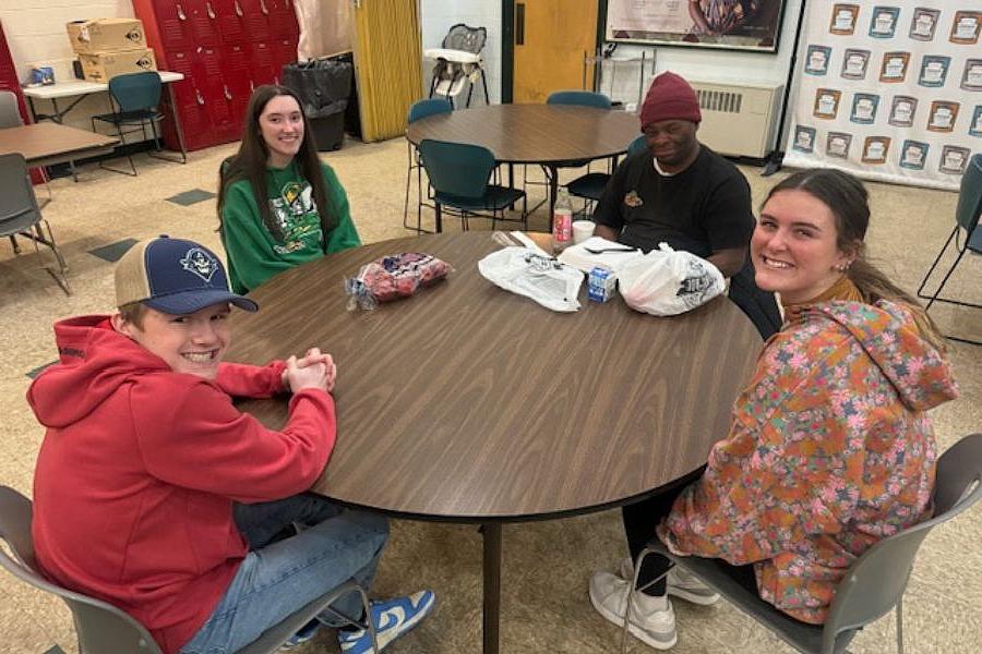 Carthage students serve a meal at a food pantry.